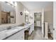 Bright bathroom featuring double sinks, vanity, tile floors, and closet at 145 Stonegate Blvd. # 145, Murrells Inlet, SC 29576