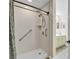 Updated bathroom featuring a step-in shower with grab bars, and double sinks at 145 Stonegate Blvd. # 145, Murrells Inlet, SC 29576