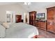 Bedroom view showcasing wood floors, ceiling fan, and dark wood furnishings at 145 Stonegate Blvd. # 145, Murrells Inlet, SC 29576