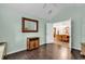 Bright bedroom with an open doorway to the dining room, wood floors, and neutral-colored walls at 145 Stonegate Blvd. # 145, Murrells Inlet, SC 29576