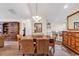 Spacious dining area with bar seating and seamless flow to the living room and bedroom at 145 Stonegate Blvd. # 145, Murrells Inlet, SC 29576