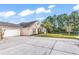 Beautiful home with brick and vinyl exterior, manicured lawn, and long concrete driveway at 145 Stonegate Blvd. # 145, Murrells Inlet, SC 29576