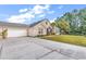 Well maintained home with brick and vinyl exterior, lush lawn, and long concrete driveway at 145 Stonegate Blvd. # 145, Murrells Inlet, SC 29576