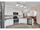 Open-concept kitchen with stainless steel appliances and a view to the dining and living areas at 145 Stonegate Blvd. # 145, Murrells Inlet, SC 29576