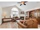 Spacious living room with a fireplace, built-in shelving, and a large window for natural light at 145 Stonegate Blvd. # 145, Murrells Inlet, SC 29576
