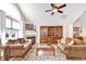 Inviting living room with a fireplace, vaulted ceilings, and a large window for natural light at 145 Stonegate Blvd. # 145, Murrells Inlet, SC 29576
