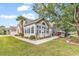 Bright sunroom addition featuring many windows with stone and tan siding at 145 Stonegate Blvd. # 145, Murrells Inlet, SC 29576