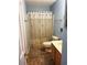 Cozy bathroom featuring a patterned shower curtain, toilet, vanity, and essential amenities at 1450 Blue Tree Ct. # I, Myrtle Beach, SC 29588