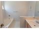 Bright bathroom featuring a soaking tub and a single sink vanity at 1512 Hallborough Dr., Surfside Beach, SC 29575