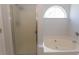Well-lit bathroom with a shower, soaking tub, and neutral decor at 1512 Hallborough Dr., Surfside Beach, SC 29575