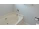 Close-up of a bathtub featuring a shower with a chrome faucet and a neutral color scheme at 1512 Hallborough Dr., Surfside Beach, SC 29575