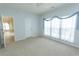 Spacious bedroom with carpet flooring, ceiling fan, and an open doorway to the house at 1512 Hallborough Dr., Surfside Beach, SC 29575