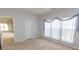 Bright bedroom featuring soft carpet, natural light, and neutral walls at 1512 Hallborough Dr., Surfside Beach, SC 29575