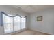 Cozy bedroom with natural light, soft carpet, and simple decor at 1512 Hallborough Dr., Surfside Beach, SC 29575