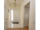 Clean entryway with tile flooring, a decorative light fixture, and access to closet space at 1512 Hallborough Dr., Surfside Beach, SC 29575