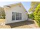 Side view of home showing three windows and the architectural design of the exterior at 1512 Hallborough Dr., Surfside Beach, SC 29575