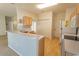 Well-lit kitchen area featuring wood cabinets, a breakfast bar, and essential appliances for easy meal preparation at 1512 Hallborough Dr., Surfside Beach, SC 29575