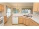 Open kitchen area with countertops and a dining area with bright window views at 1512 Hallborough Dr., Surfside Beach, SC 29575