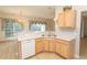 Kitchen sink and countertops with a view of the dining area and window views at 1512 Hallborough Dr., Surfside Beach, SC 29575