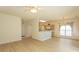 An open living space with wood-look floors and a view to the kitchen area at 1512 Hallborough Dr., Surfside Beach, SC 29575
