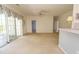 Spacious living area adjacent to the kitchen, featuring a large sliding door and neutral tones throughout at 1512 Hallborough Dr., Surfside Beach, SC 29575