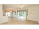 Open living area with wood-look flooring, large windows, sliding glass doors and chandelier lighting at 1512 Hallborough Dr., Surfside Beach, SC 29575