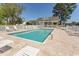 Outdoor community pool surrounded by lounge chairs and a pool house at 1512 Hallborough Dr., Surfside Beach, SC 29575