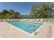Inviting community swimming pool with lounge chairs and clear blue water on a sunny day at 1512 Hallborough Dr., Surfside Beach, SC 29575