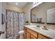 Cozy bathroom featuring a vanity and a shower with decorative curtain at 168 Zostera Dr., Little River, SC 29566