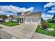 Beautiful home with a two-car garage, well-maintained lawn and vibrant landscaping at 168 Zostera Dr., Little River, SC 29566