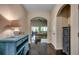 Hallway with hardwood floors and archways leading to various rooms in the house at 168 Zostera Dr., Little River, SC 29566