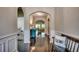 Hallway featuring wainscoting, hardwood floors, and archways to other rooms at 168 Zostera Dr., Little River, SC 29566
