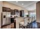 Modern kitchen with stainless steel appliances, granite countertops, and dark wood cabinets at 168 Zostera Dr., Little River, SC 29566
