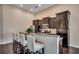 Bright kitchen features stainless appliances, a breakfast bar with four chairs, and recessed lighting at 168 Zostera Dr., Little River, SC 29566
