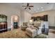 Open-concept living room with hardwood floors and a view of the kitchen at 168 Zostera Dr., Little River, SC 29566