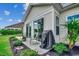 Outdoor patio features sliding glass doors, landscaping and grill at 168 Zostera Dr., Little River, SC 29566