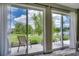 Charming patio overlooks a serene lake, offering stunning views and tranquil ambiance at 168 Zostera Dr., Little River, SC 29566