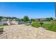 Community putting green near pond and picnic patio, accessible by a charming walkway at 168 Zostera Dr., Little River, SC 29566