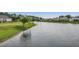 Picturesque view of a pond with a fountain, surrounded by well-maintained lawns and neighborhood homes at 168 Zostera Dr., Little River, SC 29566