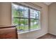 Inviting view of a pond and the lush landscaping from a bedroom window at 168 Zostera Dr., Little River, SC 29566