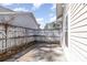 Enclosed back patio area with a wooden fence and a small concrete pad at 174 Sussex Ct., Longs, SC 29568