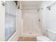 Bright bathroom featuring a tiled floor, stand up shower, toilet, and window providing natural light at 174 Sussex Ct., Longs, SC 29568