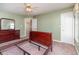 Cozy bedroom with a ceiling fan, dresser, doorway view, and carpet, bathed in soft natural light at 174 Sussex Ct., Longs, SC 29568