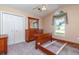 Inviting bedroom features a vaulted ceiling, dresser with mirror, and a window offering natural light at 174 Sussex Ct., Longs, SC 29568