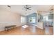 Open dining room area with modern light fixture, large windows, and wood-look floors at 174 Sussex Ct., Longs, SC 29568