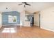 Open dining room area, featuring large windows and wood-look floors at 174 Sussex Ct., Longs, SC 29568