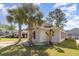 A single-story home with a well-manicured lawn, mature trees, brick accents and a paved driveway at 174 Sussex Ct., Longs, SC 29568