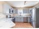 Modern kitchen with stainless steel appliances, grey cabinets, and bright countertops at 174 Sussex Ct., Longs, SC 29568