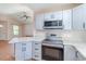 Modern kitchen featuring stainless steel appliances, grey cabinets, and bright countertops at 174 Sussex Ct., Longs, SC 29568