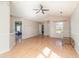 Bright living room featuring a ceiling fan, vaulted ceiling, and wood-look floors at 174 Sussex Ct., Longs, SC 29568